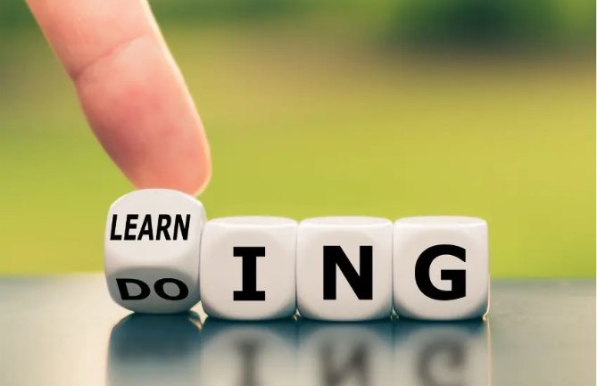 Dice being turned to change the word "doing" into "learning"